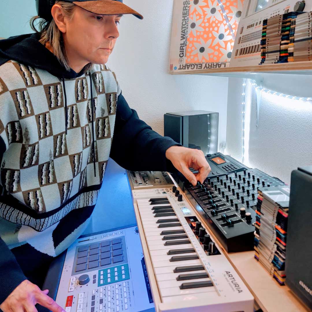 Keith Griego, alias DJ Design, in his studio with drum machines