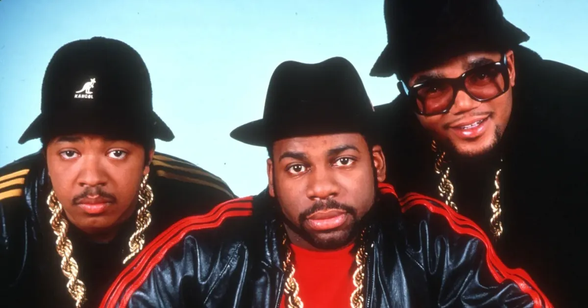 rappers wearing Adidas tracksuits, golden chains and bucket hats, the old school group Run DMC