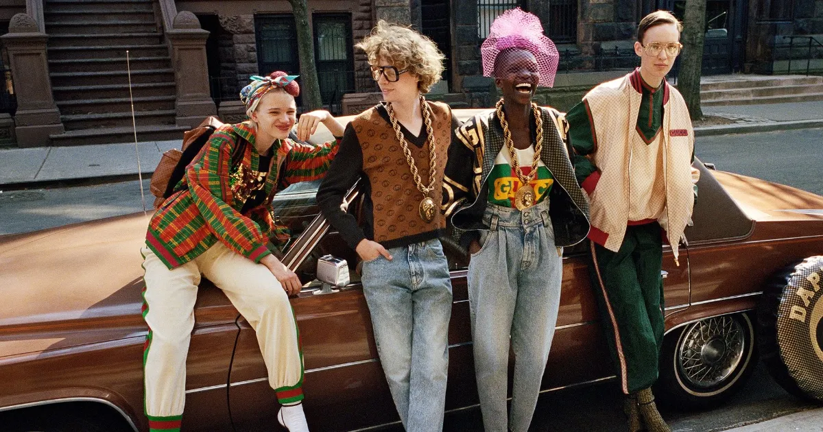 A diverse group of young people with different skin colors wearing clothes from a Gucci Streetwear and Luxury collaboration with Dapper Dan
