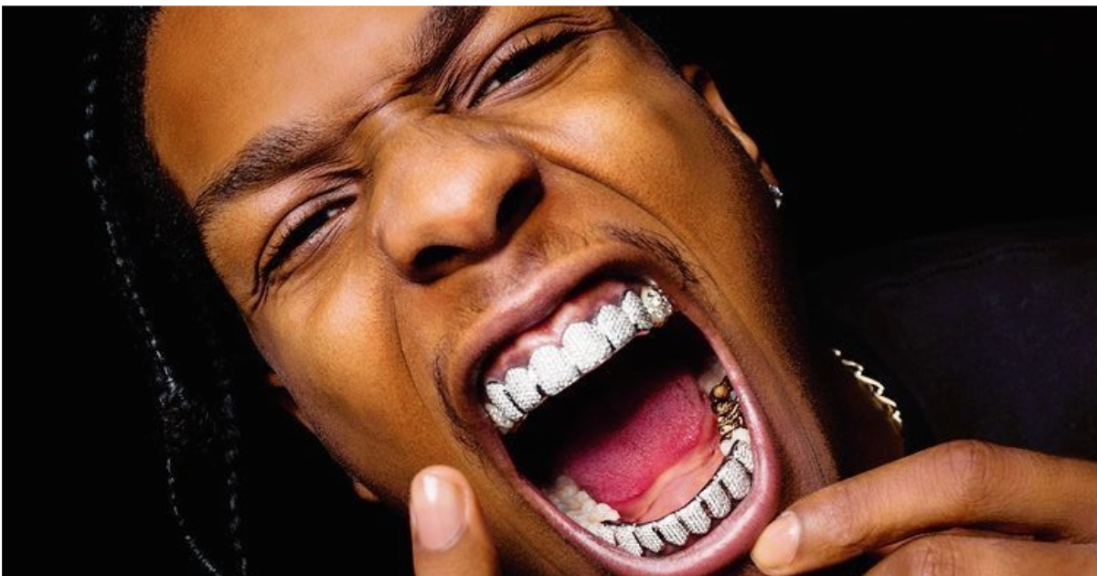 Rapper ASAP Rocky wearing diamond grillz with mouth wide open