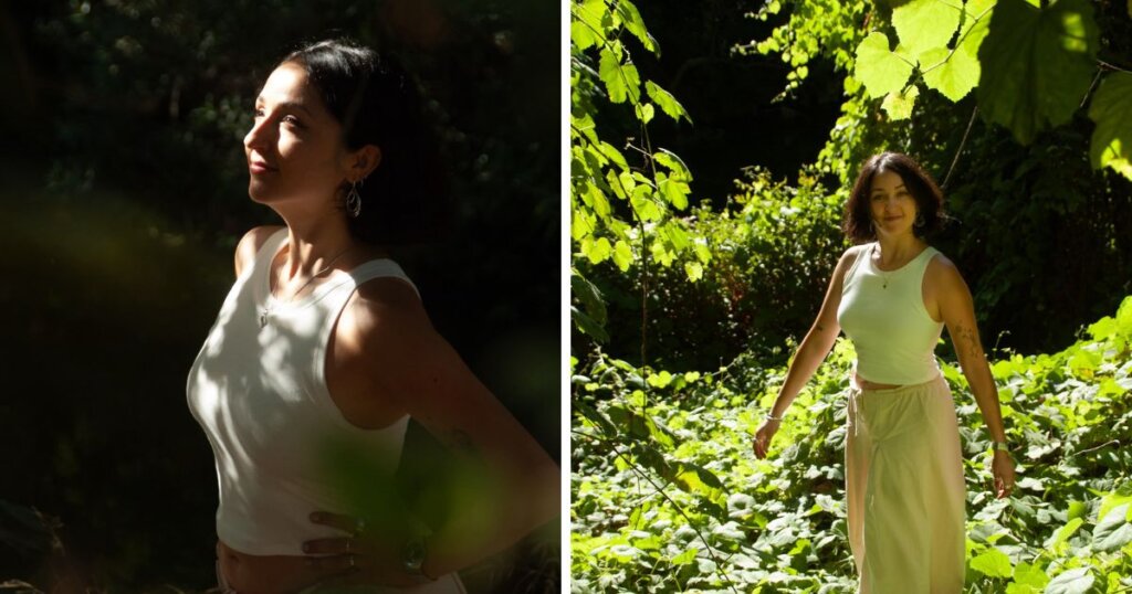 DJ Paulita smiling in a forest clearing